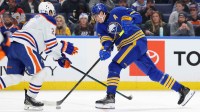Edmonton Oilers defenseman Evan Bouchard (2) tries to block a shot by Buffalo Sabres center Tage Thompson (72) during the second period at KeyBank Center.
