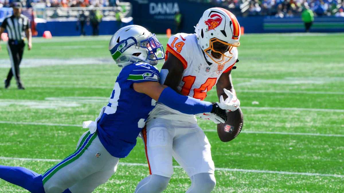 Seattle Seahawks safety Ty Okada (39) breaks up a pass to Tampa Bay Buccaneers wide receiver Chris Godwin Jr. (14) during the first half at Lumen Field.