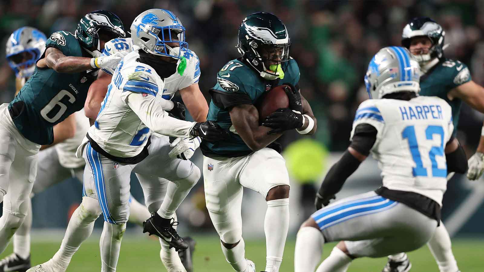Philadelphia Eagles running back Tank Bigsby (37) rushes the ball against Detroit Lions safety Thomas Harper (12) during the first half at Lincoln Financial Field.