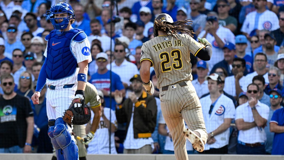 San Diego Padres outfielder Fernando Tatis Jr. (23) scores a run on an RBI single sacrifice fly in the first inning against the Chicago Cubs during game two of the Wildcard round for the 2025 MLB playoffs at Wrigley Field.