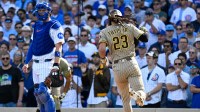 San Diego Padres outfielder Fernando Tatis Jr. (23) scores a run on an RBI single sacrifice fly in the first inning against the Chicago Cubs during game two of the Wildcard round for the 2025 MLB playoffs at Wrigley Field.