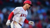 Los Angeles Angels designated hitter Taylor Ward (3) runs after hitting at Angel Stadium.