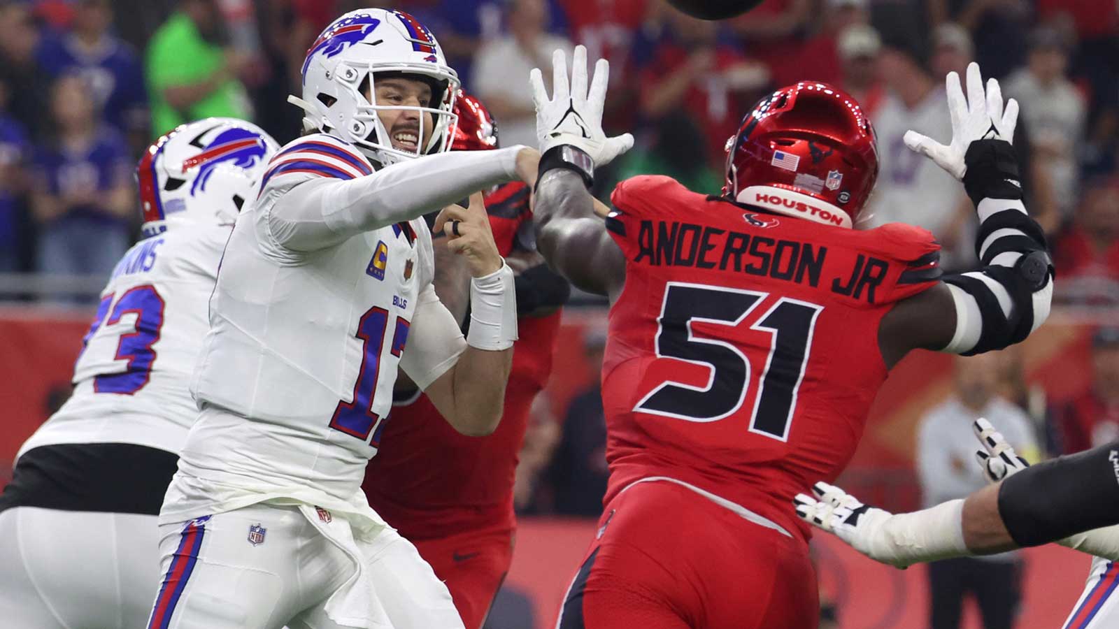 Buffalo Bills quarterback Josh Allen (17) throws a pass against Houston Texans defensive end Will Anderson Jr. (51) in the first quarter at NRG Stadium.