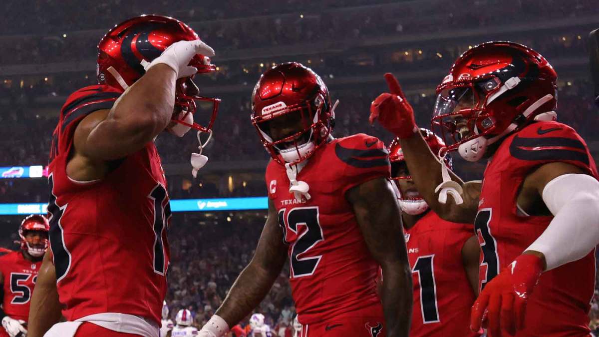 Houston Texans wide receiver Christian Kirk (13) celebrates with wide receiver Xavier Hutchinson (19) after scoring a touchdown against the Buffalo Bills in the second quarter at NRG Stadium.