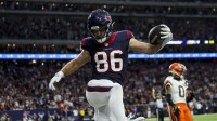 Houston Texans tight end Dalton Schultz (86) scores a touchdown during the second quarter in a 2024 AFC wild card game at NRG Stadium.