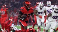 Houston Texans running back Woody Marks (27) runs against the Buffalo Bills in the first quarter at NRG Stadium.