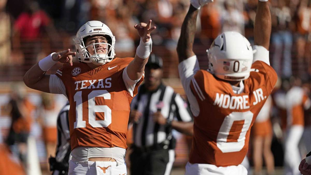 Texas Longhorns quarterback Arch Manning (16) reacts after throwing a touchdown pass in the first half against the Arkansas Razorbacks at Darrell K Royal-Texas Memorial Stadium.