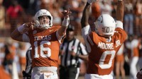 Texas Longhorns quarterback Arch Manning (16) reacts after throwing a touchdown pass in the first half against the Arkansas Razorbacks at Darrell K Royal-Texas Memorial Stadium.