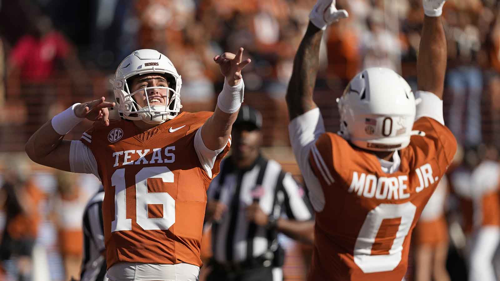 Texas Longhorns quarterback Arch Manning (16) reacts after throwing a touchdown pass in the first half against the Arkansas Razorbacks at Darrell K Royal-Texas Memorial Stadium. 