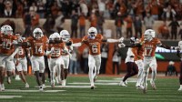 Texas Longhorns defensive back Kobe Black (6) and teammates react after making an interception during the second half against the Texas A&M Aggies at Darrell K Royal-Texas Memorial Stadium. Mandatory Credit: Scott Wachter-Imagn Images