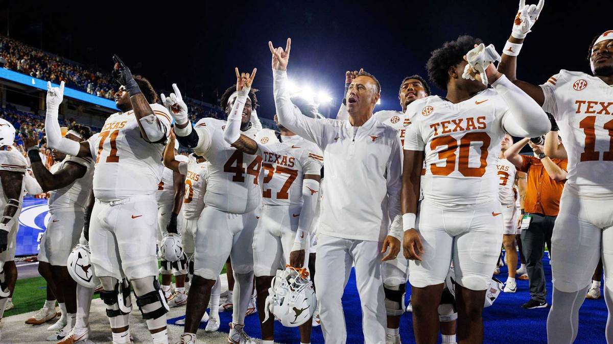 Texas Longhorns head coach Steve Sarkisian celebrates with his team after winning the game against the Kentucky Wildcats at Kroger Field.