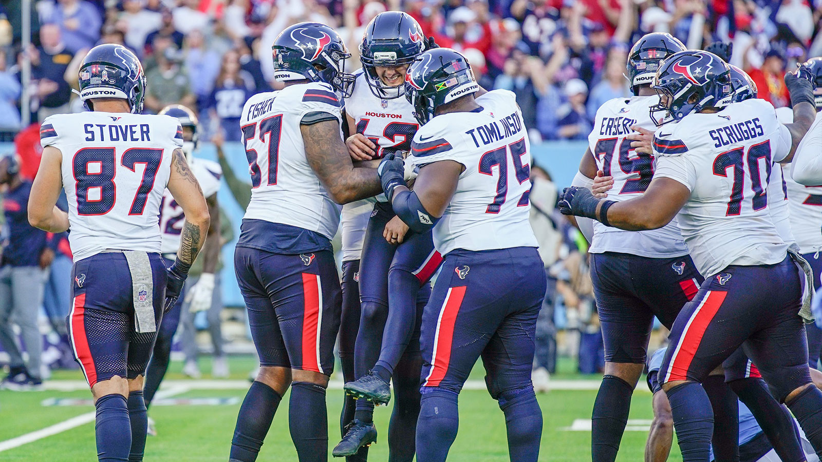 Houston Texans kicker Matthew Wright (42) is mobbed by teammates after kicking the game-winning field goal during the fourth quarter against the Tennessee Titans at Nissan Stadium in Nashville, Tenn., Sunday, Nov. 16, 2025.