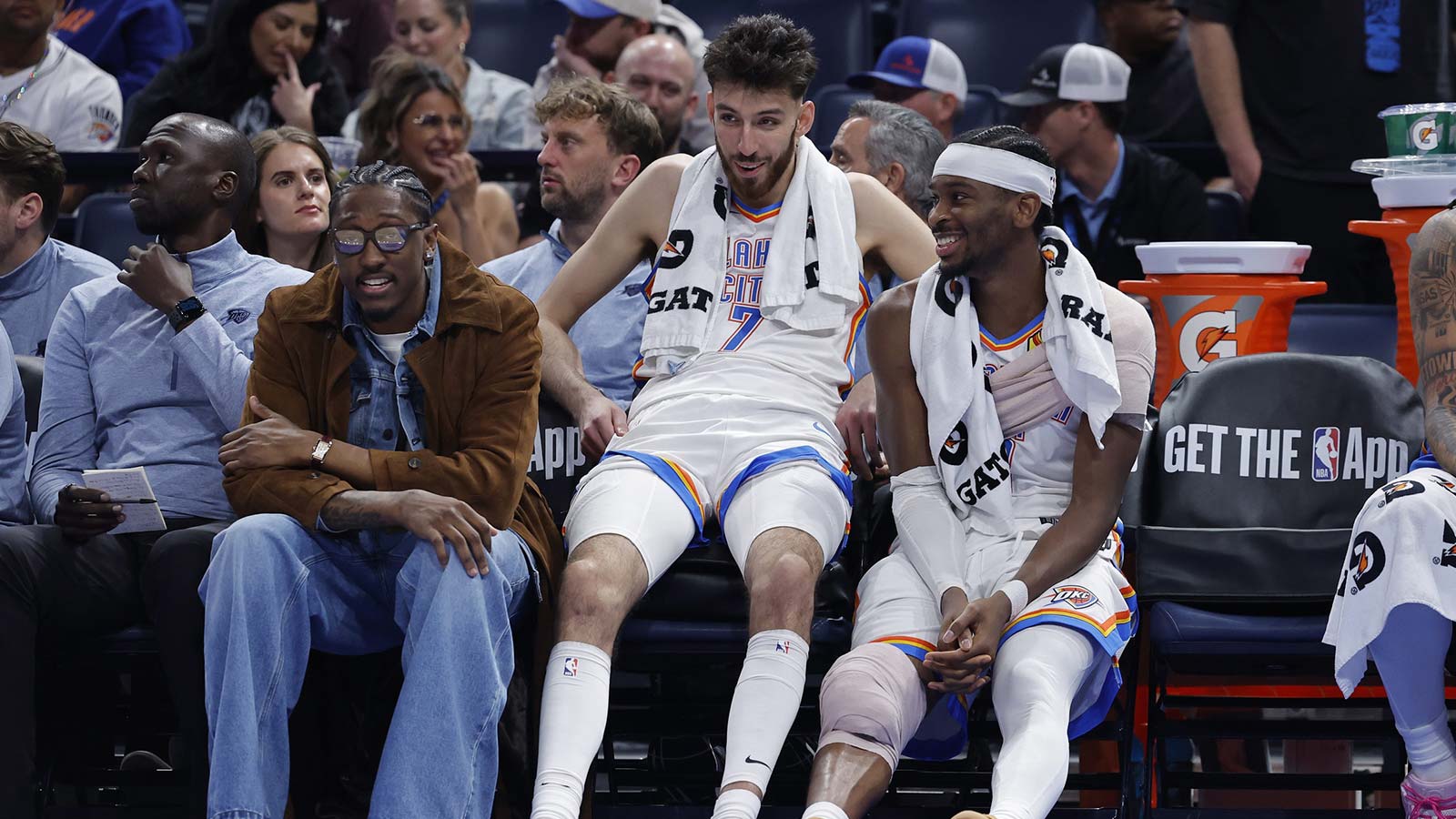 Thunder guard Jalen Williams (8), center Chet Holmgren (7), and guard Shai Gilgeous-Alexander (2) talk while sitting on the bench during the fourth quarter against the Los Angeles Lakers at Paycom Center