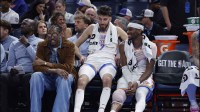Thunder guard Jalen Williams (8), center Chet Holmgren (7), and guard Shai Gilgeous-Alexander (2) talk while sitting on the bench during the fourth quarter against the Los Angeles Lakers at Paycom Center