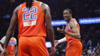 Thunder guard Jalen Williams (8) smiles after scoring against the Phoenix Suns during the second half at Paycom Center with Thunder head coach Mark Daigneault in the background