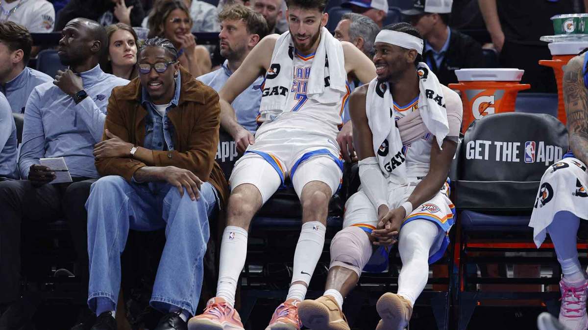 Thunder guard Jalen Williams (8), center Chet Holmgren (7), and guard Shai Gilgeous-Alexander (2) talk while sitting on the bench during the fourth quarter against the Los Angeles Lakers at Paycom Center with Thunder head coach Mark Daigneault in the background