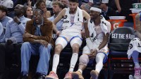 Thunder guard Jalen Williams (8), center Chet Holmgren (7), and guard Shai Gilgeous-Alexander (2) talk while sitting on the bench during the fourth quarter against the Los Angeles Lakers at Paycom Center with Thunder head coach Mark Daigneault in the background