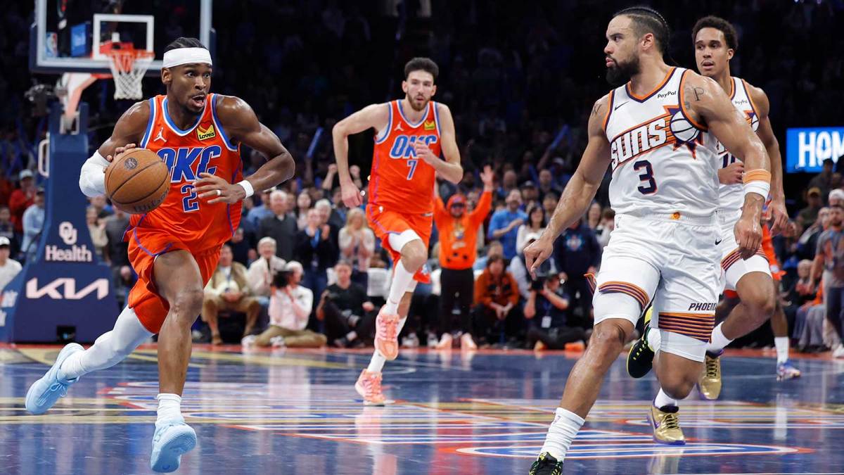 Thunder guard Shai Gilgeous-Alexander (2) drives down the court beside Phoenix Suns forward Dillon Brooks (3) during the second half at Paycom Center