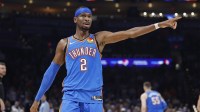 Thunder guard Shai Gilgeous-Alexander (2) gestures to his team before a play against the Portland Trail Blazers during the second quarter at Paycom Center
