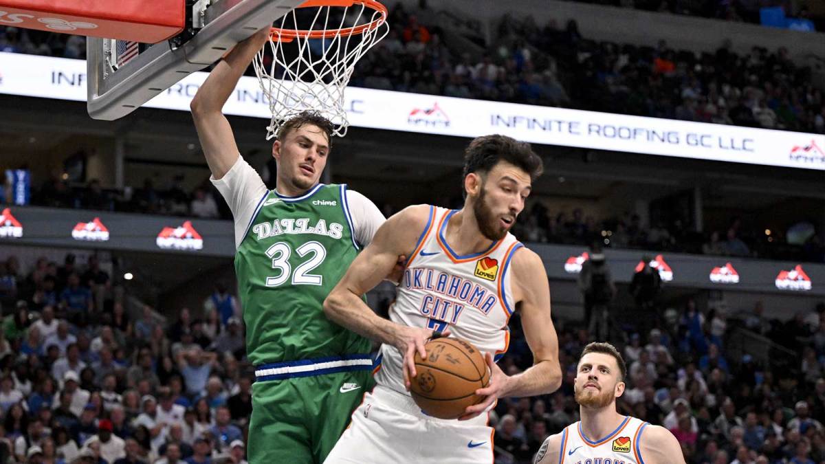 Oklahoma City Thunder center Chet Holmgren (7) grabs a rebound in front of Dallas Mavericks forward Cooper Flagg (32) during the second half at the American Airlines Center.