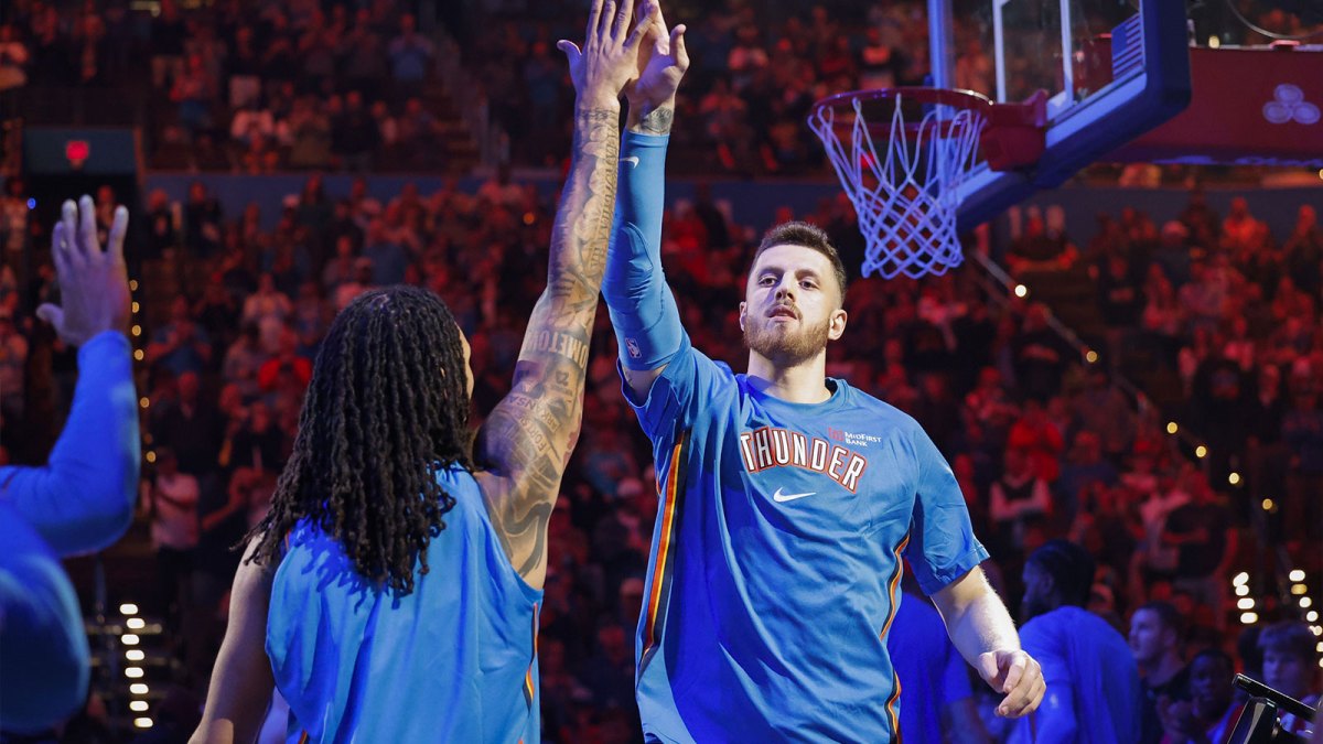 Thunder center Isaiah Hartenstein (55) during introductions before a game against the Washington Wizards at Paycom Center with Thunder head coach Mark Daigneault in the background