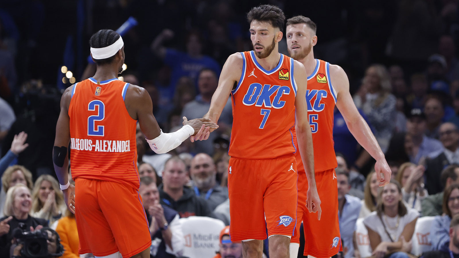 Thunder center Chet Holmgren (7) and Oklahoma City Thunder guard Shai Gilgeous-Alexander (2) celebrate after scoring against the Golden State Warriors during the second half at Paycom Center