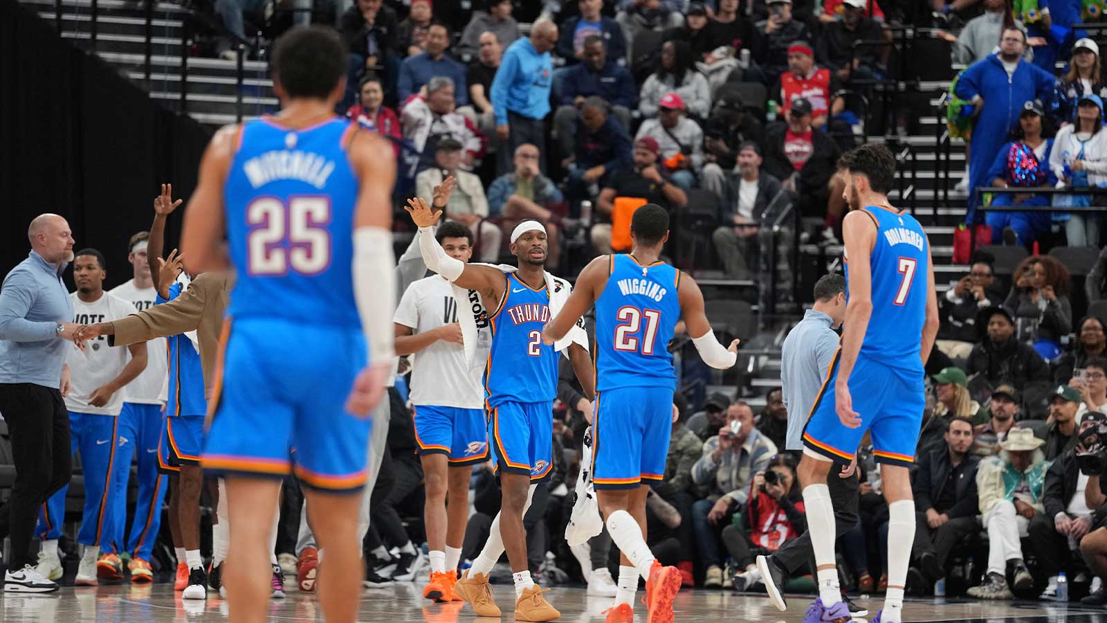 Thunder guard Shai Gilgeous-Alexander (2), guard Aaron Wiggins (21) and center Chet Holmgren (7) celebrate against the LA Clippers in the second half at Intuit Dome