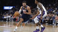 Thunder guard Ajay Mitchell (25) drives to the basket around Sacramento Kings guard Malik Monk (0) during the second half at Paycom Center