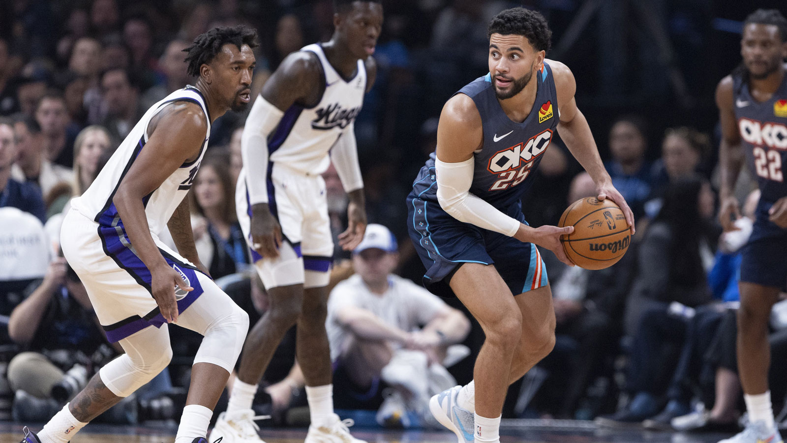 Thunder guard Ajay Mitchell (25) looks to pass against the Sacramento Kings during the second quarter at Paycom Center