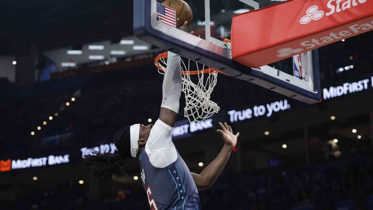 Thunder guard Luguentz Dort (5) goes to the basket against the Sacramento Kings during the second half at Paycom Center