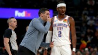 Thunder head coach Mark Daigneault talks with guard Shai Gilgeous-Alexander (2) during the third quarter against the Memphis Grizzlies at FedExForum
