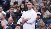 Thunder head coach Mark Daigneault watches play against the Utah Jazz during the first half at Delta Center with Chet Holmgren and Chris Paul in the background