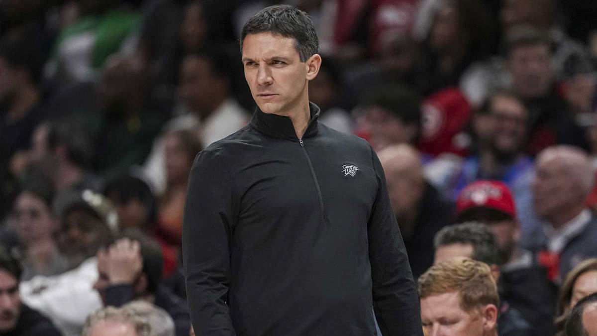 Thunder head coach Mark Daigneault reacts on the bench against the Atlanta Hawks during the first half at State Farm Arena with the Trail Blazers logo and Thunder guard Ajay Mitchell in the background