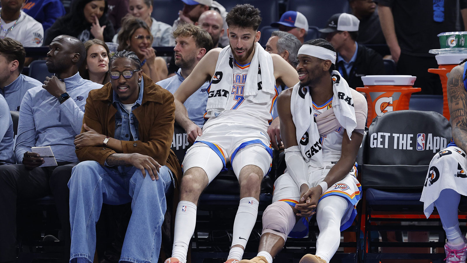 Thunder guard Jalen Williams (8), center Chet Holmgren (7), and guard Shai Gilgeous-Alexander (2) talk while sitting on the bench during the fourth quarter against the Los Angeles Lakers at Paycom Center