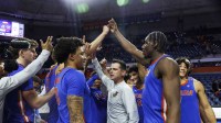 Florida Gators head coach Todd Golden (center) huddle up after the game against Florida State Seminoles at Exactech Arena at the Stephen C. O'Connell Center.