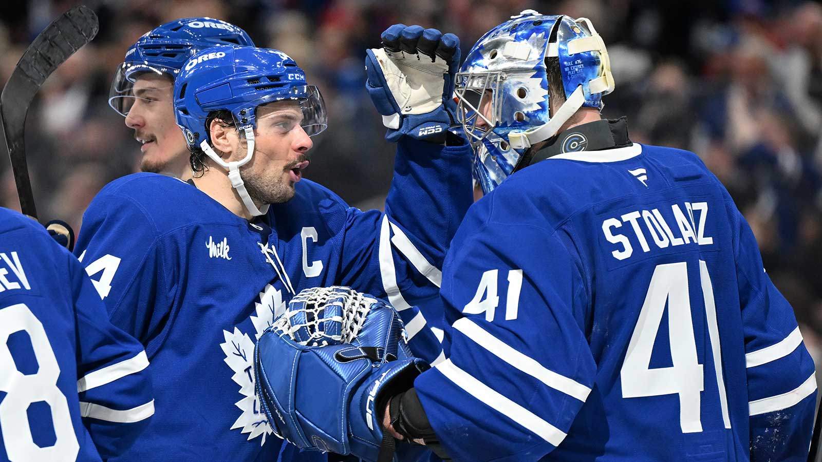 Toronto Maple Leafs goalie Anthony Stolarz (41) is greeted by forward Auston Matthews (34) as they celebrate an overtime win over the Montreal Canadiens at Scotiabank Arena.