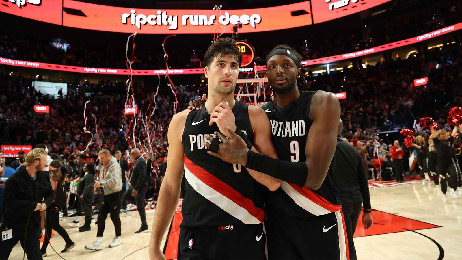 Trail Blazers forward Deni Avdija (8) and forward Jerami Grant (9) react after the game against Oklahoma City Thunder at the Moda Center