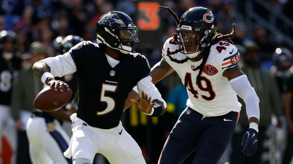 Baltimore Ravens quarterback Tyler Huntley (5) scrambles from Chicago Bears linebacker Tremaine Edmunds (49) in the second quarter at M&T Bank Stadium.