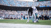 Dallas Cowboys cornerback Trevon Diggs (7) kneels before the start of the game against the Carolina Panthers at Bank of America Stadium.