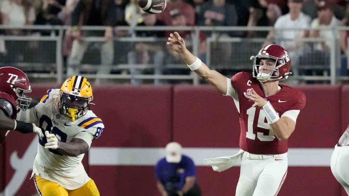 Alabama quarterback Ty Simpson (15) throws as he is pressured by LSU defensive lineman Bernard Gooden (88) at Saban Field at Bryant-Denny Stadium.