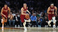 Miami Heat guard Tyler Herro (14) brings the ball up the court against the Dallas Mavericks in the first half at Kaseya Center.