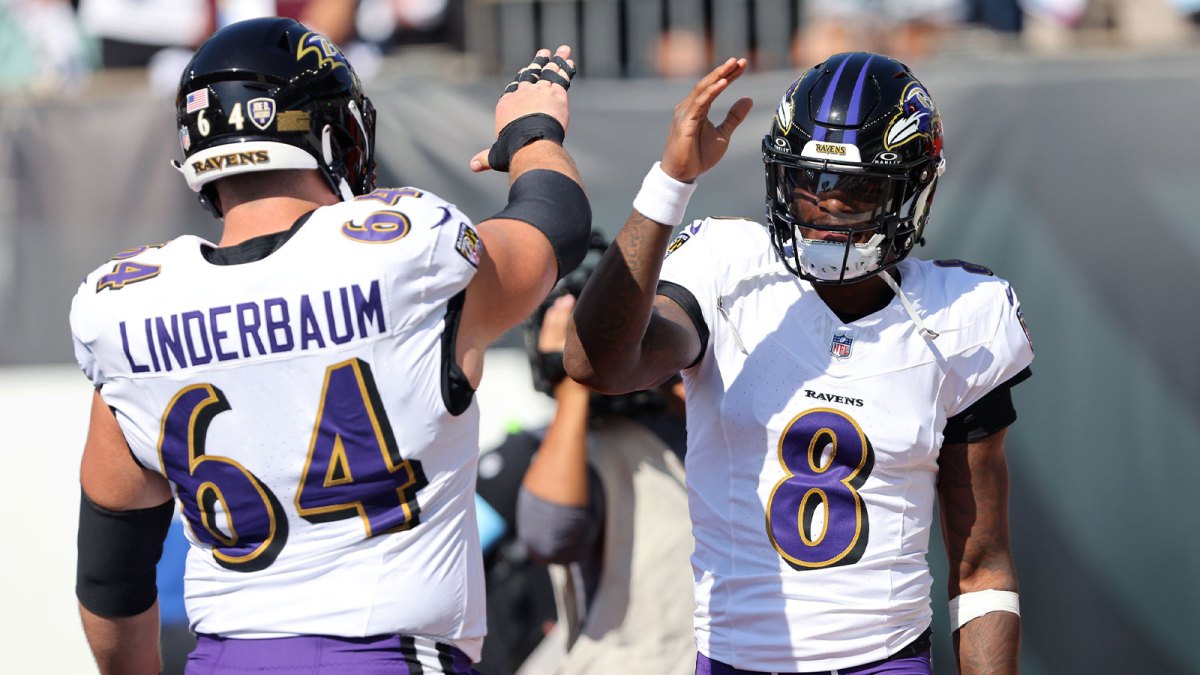 Baltimore Ravens quarterback Lamar Jackson (8) and center Tyler Linderbaum (64) warm up before the game against the Cincinnati Bengals at Paycor Stadium.