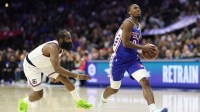 Philadelphia 76ers guard Tyrese Maxey (0) drives past LA Clippers guard James Harden (1) during the second quarter at Xfinity Mobile Arena.