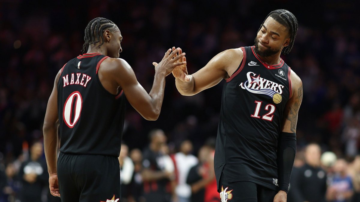 Philadelphia 76ers guard Tyrese Maxey (0) and forward Trendon Watford (12) celebrate during the final moments before a victory against the Toronto Raptors at Xfinity Mobile Arena.