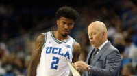 UCLA Bruins head coach Mick Cronin talks to guard Donovan Dent (2) during the second half against the Eastern Washington Eagles at Pauley Pavilion presented by Wescom Financial.