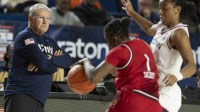 UConn Huskies head coach Geno Auriemma looks onto the court as guard Kk Arnold (2) defends Louisville Cardinals guard Reyna Scott (1) second half.