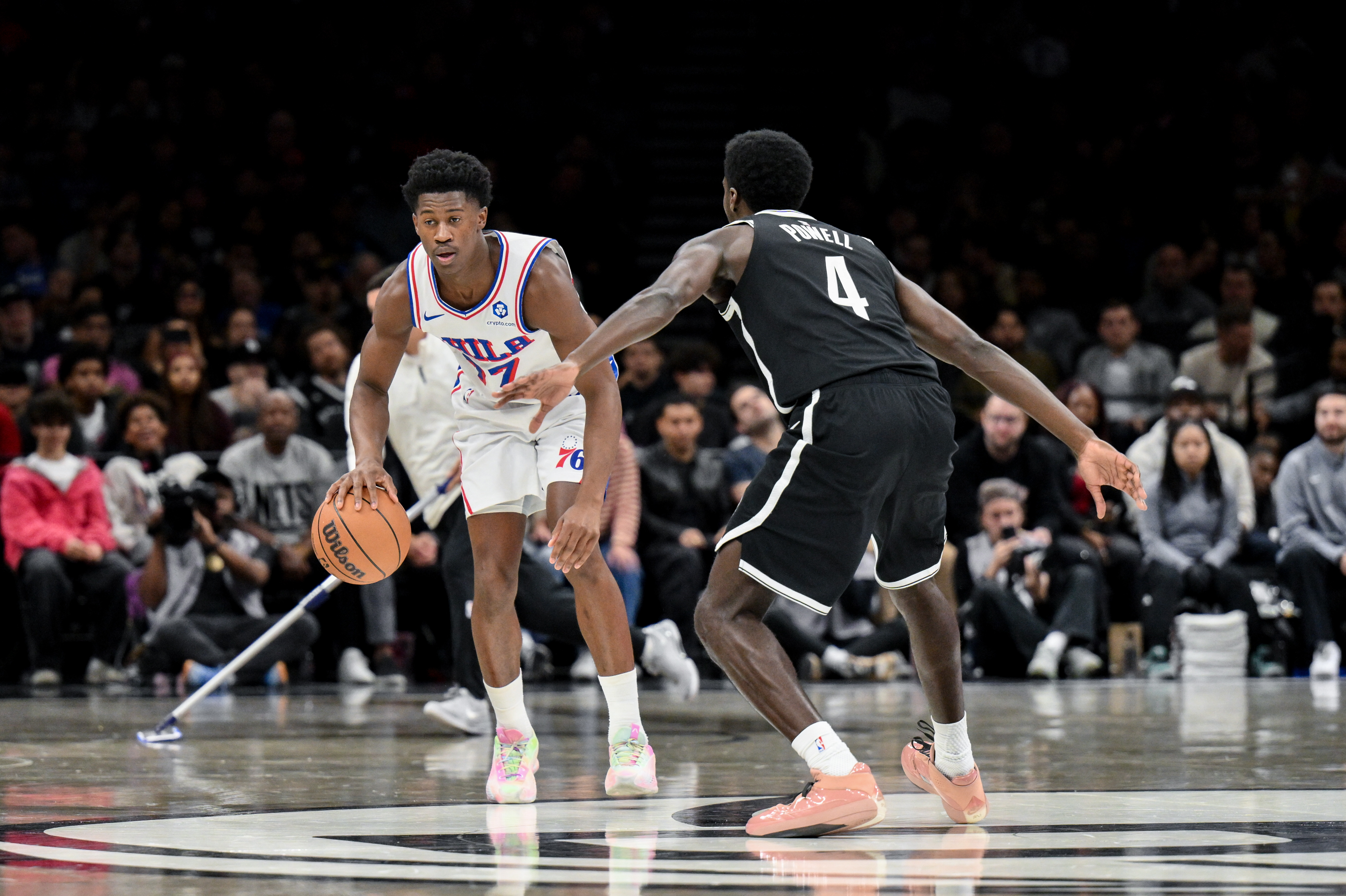 Philadelphia 76ers guard VJ Edgecombe (77) brings the ball up court while defended by Brooklyn Nets guard Drake Powell (4) during the first half at Barclays Center.