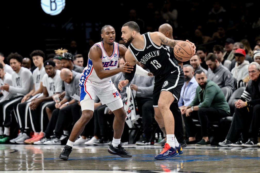 Brooklyn Nets guard Tyrese Martin (13) sets the play while defended by Philadelphia 76ers guard Tyrese Maxey (0) during the first half at Barclays Center.