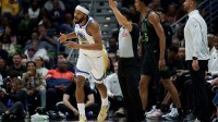 Golden State Warriors guard Moses Moody (4) celebrates a three point basket against New Orleans Pelicans forward Trey Murphy III (25) during the first half at Smoothie King Center.