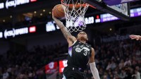 Utah Jazz guard Keyonte George (3) dunks the ball against the Sacramento Kings during the second half at Delta Center.